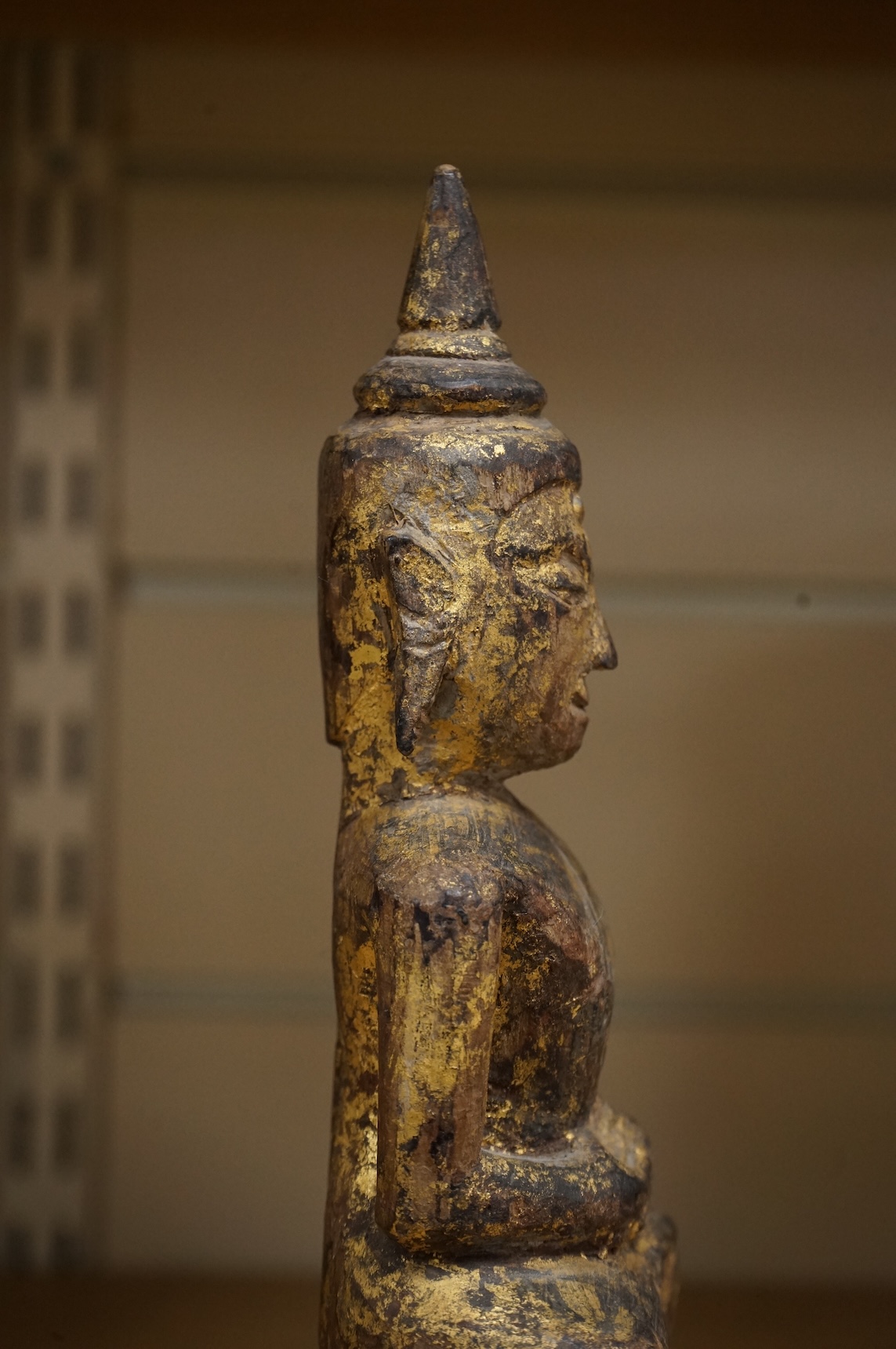 A Burmese giltwood figure of seated Buddha, 24cm high